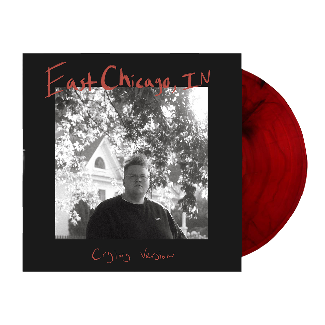 Vinyl record album with a black and white cover photo and red vinyl disc.