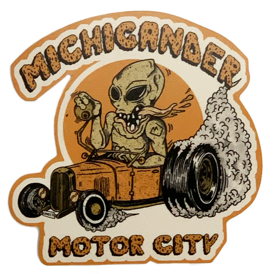 Retro-style sticker featuring an alien skeleton driving a hot rod with ’Michigander Motor City’ text.