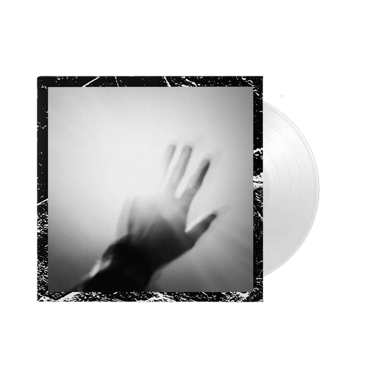 Silhouette of a hand pressed against a foggy or frosted surface.