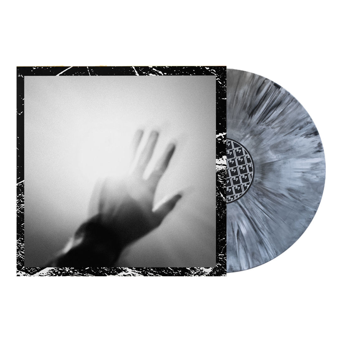 Vinyl record with album cover featuring a shadowy hand silhouette.