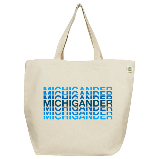 Canvas tote bag with ’MICHIGANDER’ printed repeatedly in blue shades.